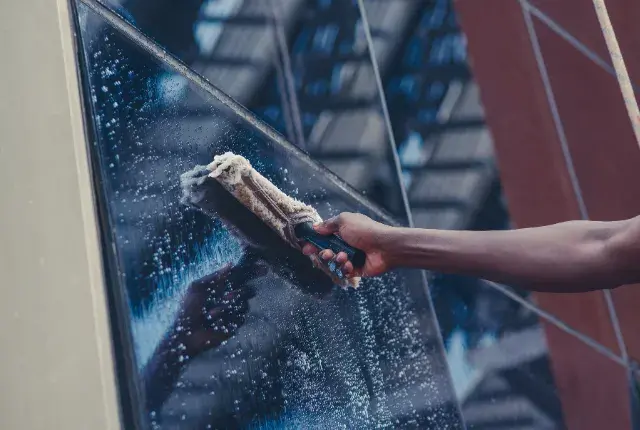 A Window Cleaner Cleaning Window A Window Cleaner Cleaning Window