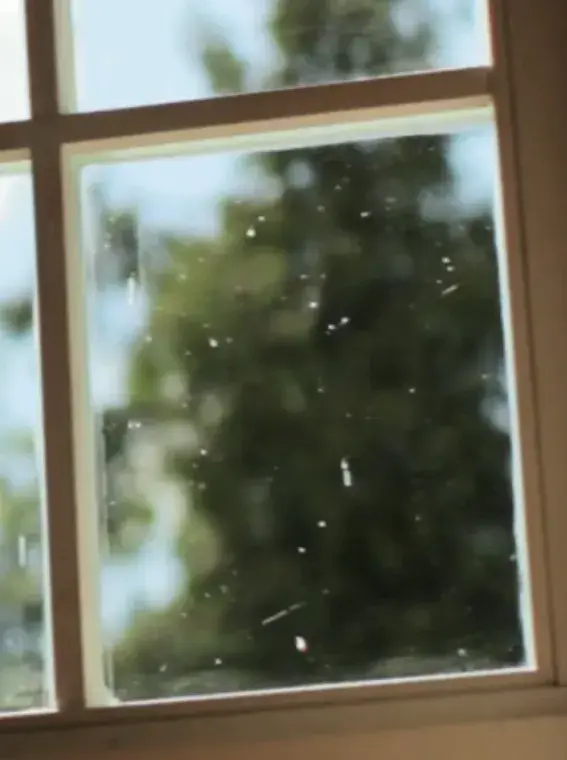 Hard water spots on a window glass Hard water spots on a window glass